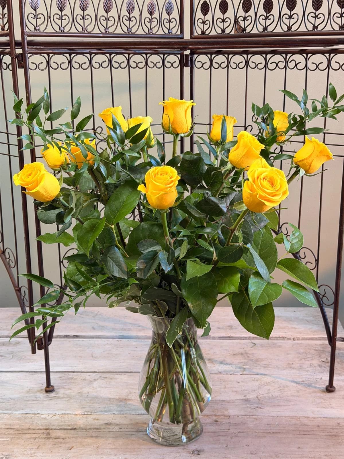 Dozen Yellow Long Stem Roses in a Vase